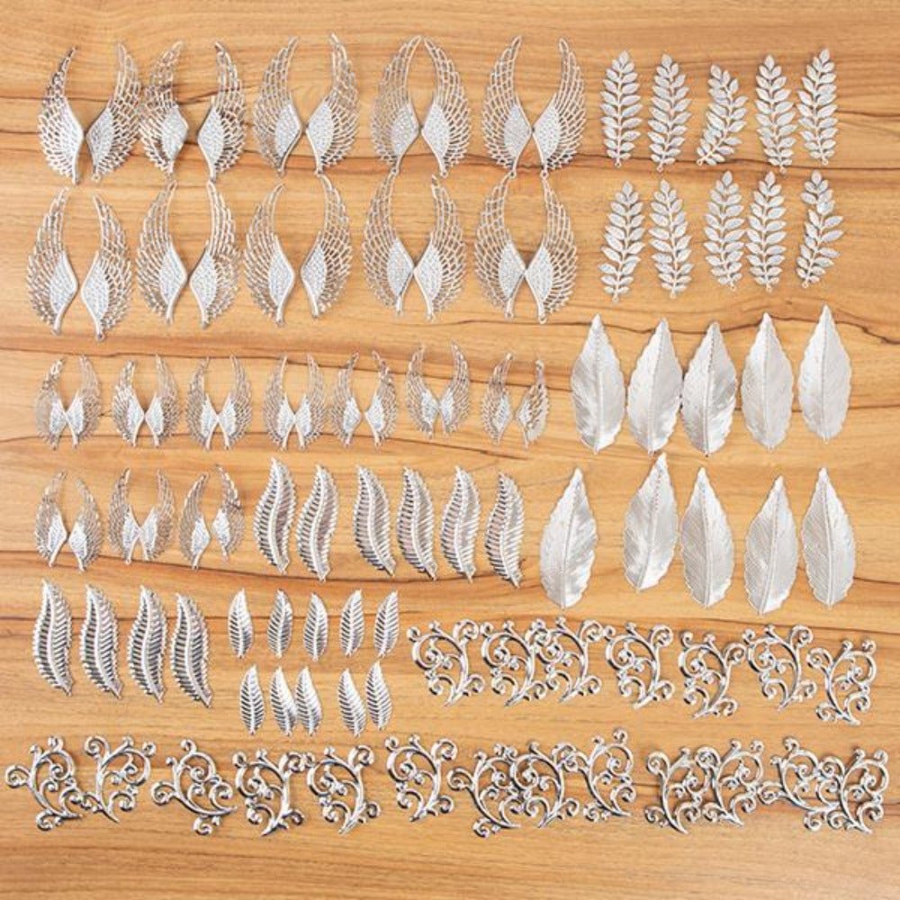 537945: Craft Buddy Set of 100 Filigree Feather, Flourish and Leaf Embellishments