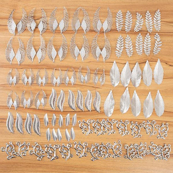 537945: Craft Buddy Set of 100 Filigree Feather, Flourish and Leaf Embellishments